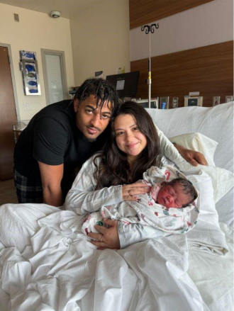 Parents Angelina Villarreal, right, and Tyrone Johnson pose with their baby Vellah Johnson, who was born at 1:18 a.m. New Year's Day at UCHealth Longs Peak Hospital in Longmont. (Photo courtesy of Longs Peak Hospital) 